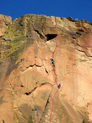 The rock climbing route called Spiderman at Smith Rock with a red line showing the popular path
